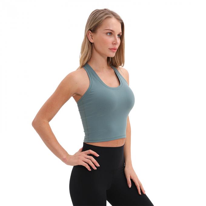 Der Longline-Sport-BH Wirefree der Großhandelsfrauen füllte mittlere Stützkundenspezifische Trägershirt-Frauen-weißes Ernte-Trägershirt auf