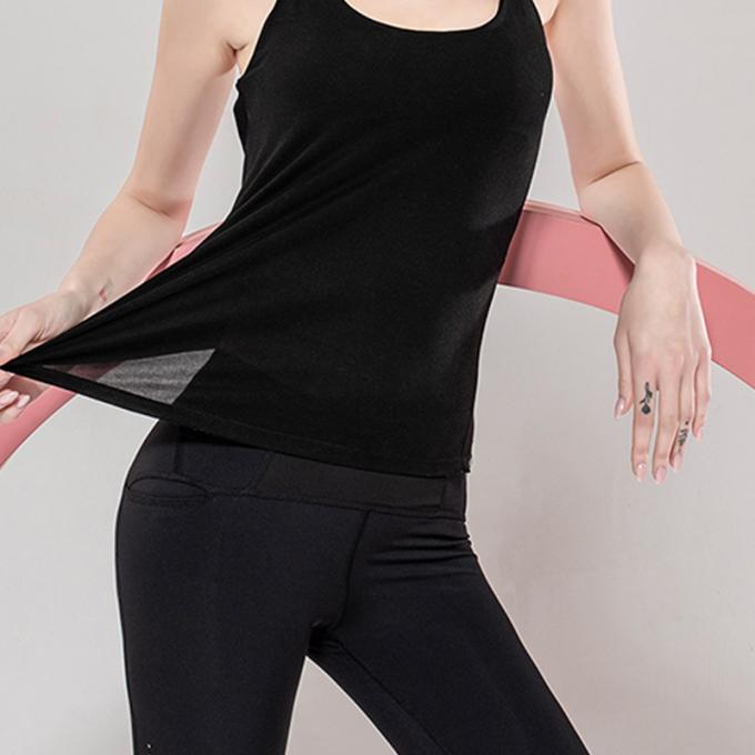Großhandelssport bekleidet die Eignungs-die Kleidung der Frauen, die Spitzenschönheit zurück laufen lässt, zur Schau trägt oberste lose Yoga-Spitze mit BH