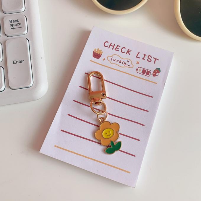 Großhandelskaninchenschlüsselkette kleines Blumen-Metallhängende Tasche verziert Zusatz-nette Karikatur Keychains für Frauen