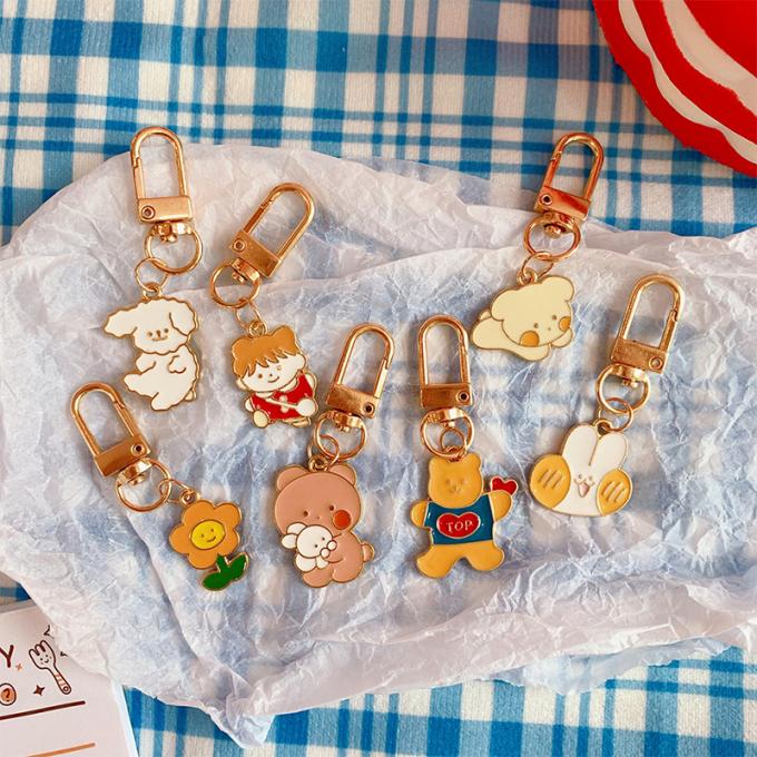 Großhandelskaninchenschlüsselkette kleines Blumen-Metallhängende Tasche verziert Zusatz-nette Karikatur Keychains für Frauen
