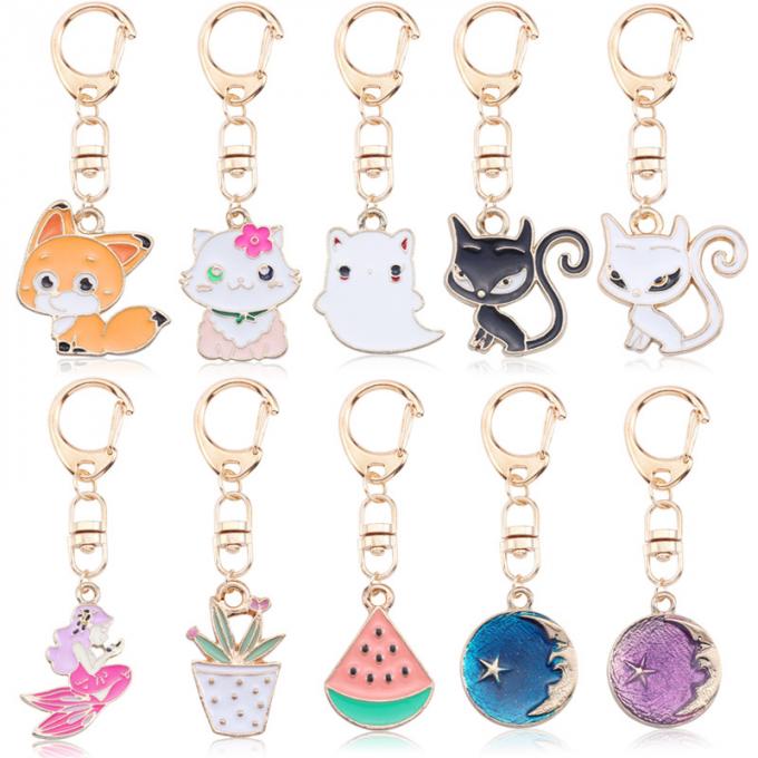 Großhandels- Schlüssel- Ring Metal Pendant Women Bag Zusätze Kristall-Keyhains Diamond Crystal Mermaids Watermelons Moon Cars für Geschenke